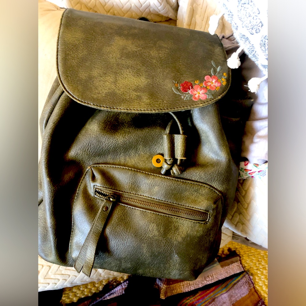 Olive green floral under one sky back pack pockets and resizable straps